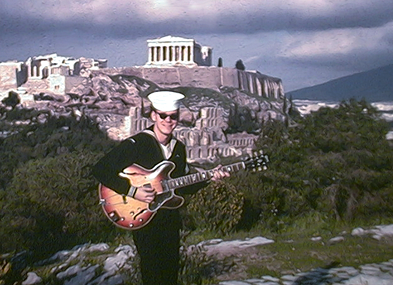Dan with guitar near the Acropolis
